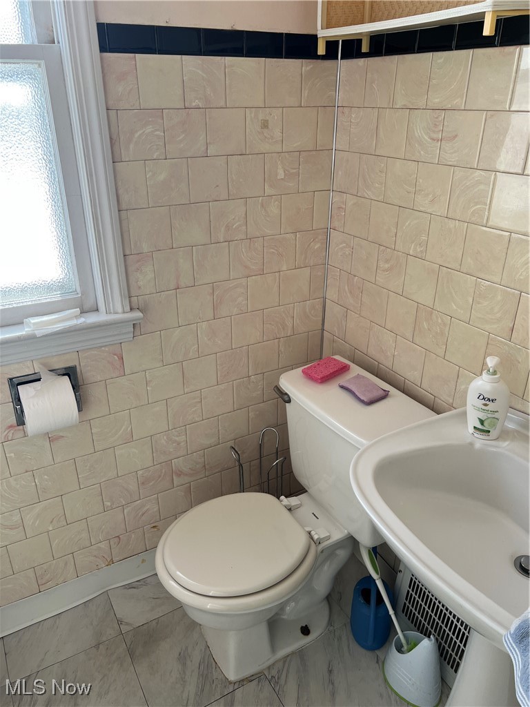 21600 Franklin Road Maple Heights, OH 44137 - Photo 10 of 14 Half bath with tile walls and toilet