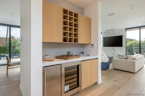 a view of kitchen with microwave stove top oven and cabinets
