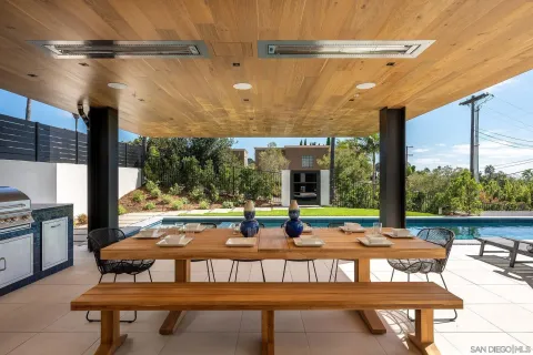 a balcony with furniture and a potted plant