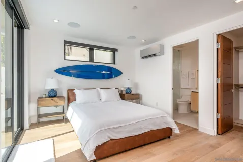 a bedroom with a bed and a view of bathroom