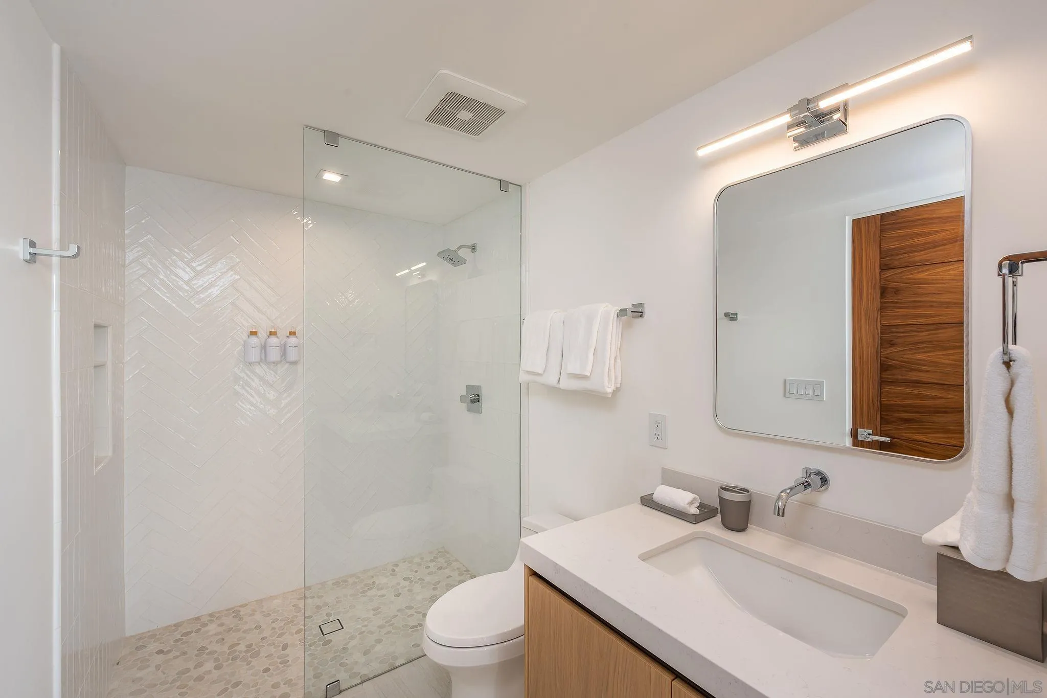 1605 Burgundy Road Encinitas, CA 92024 - Photo 27 of 49 a bathroom with a sink toilet and shower