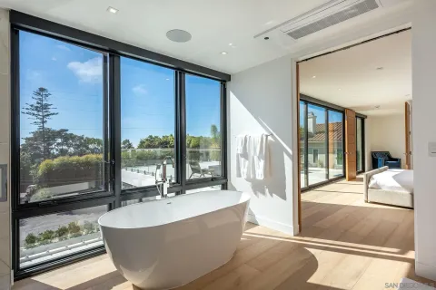 a spacious bathroom with a large tub and shower