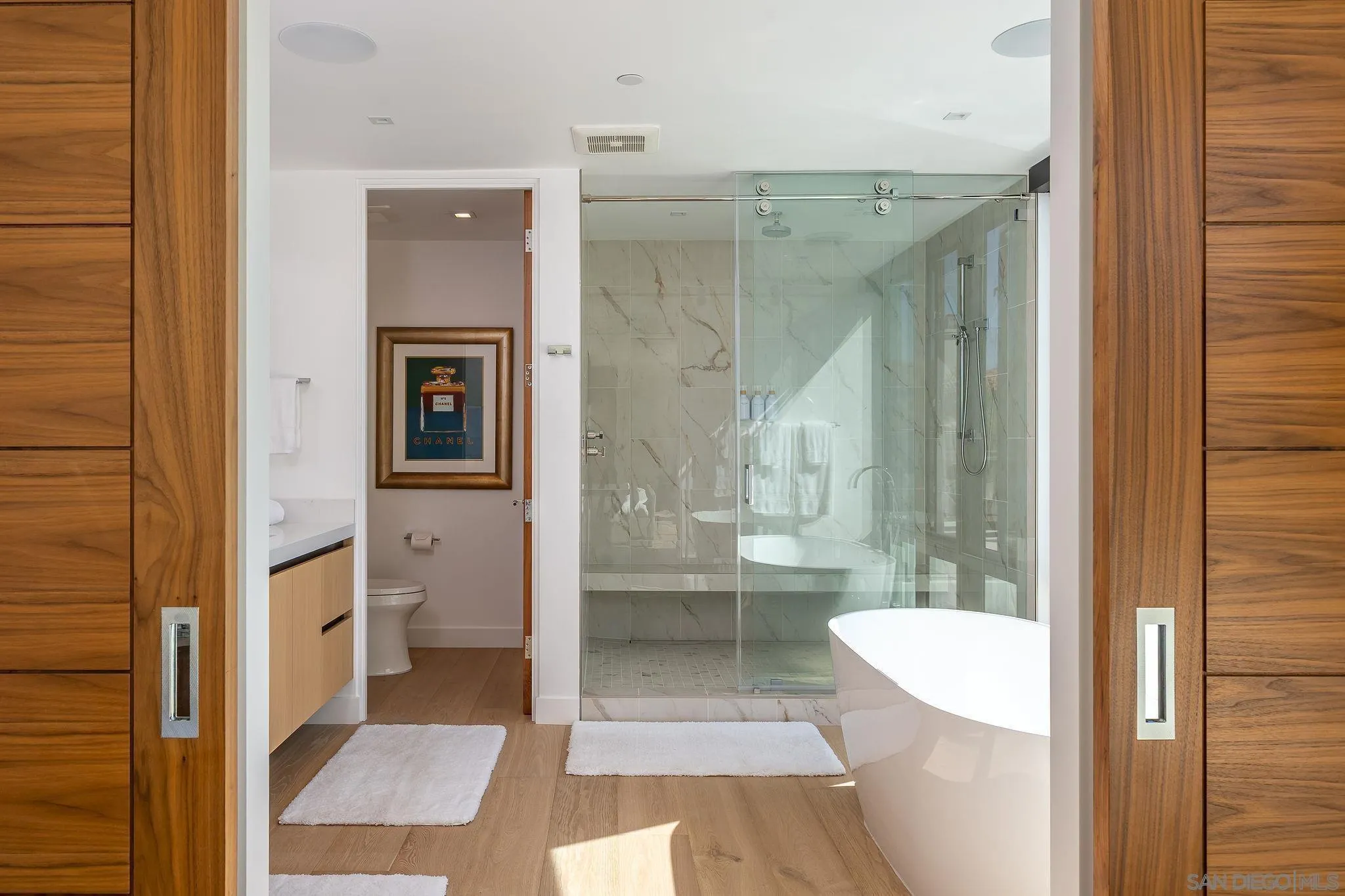 1605 Burgundy Road Encinitas, CA 92024 - Photo 33 of 49 a bathroom with a granite countertop shower a sink and toilet