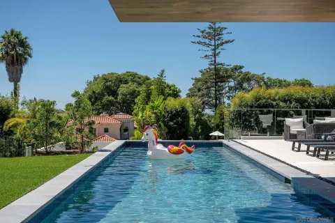 a swimming pool with a mountain view
