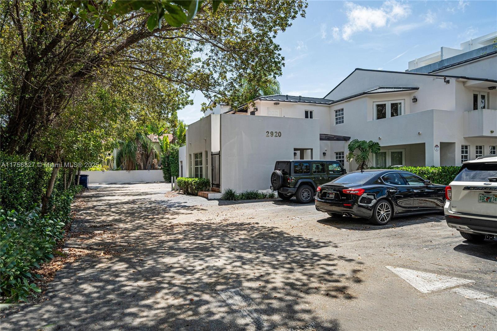 2918 Bird Avenue, Unit 8 Miami, FL 33133 - Photo 9 of 11 a car parked in front of a white house