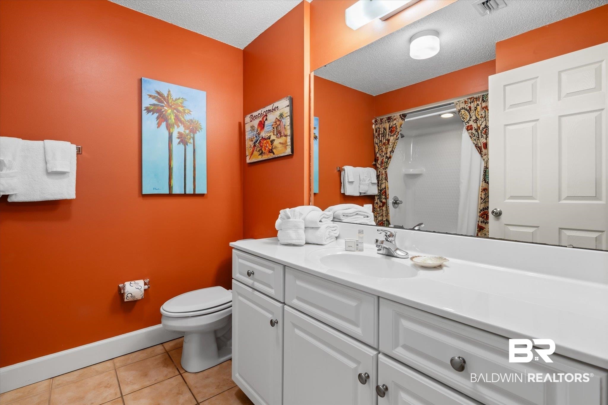 27580 Canal Road, Unit 1423 Orange Beach, AL 36561 - Photo 16 of 34 Guest bathroom with light tile flooring.