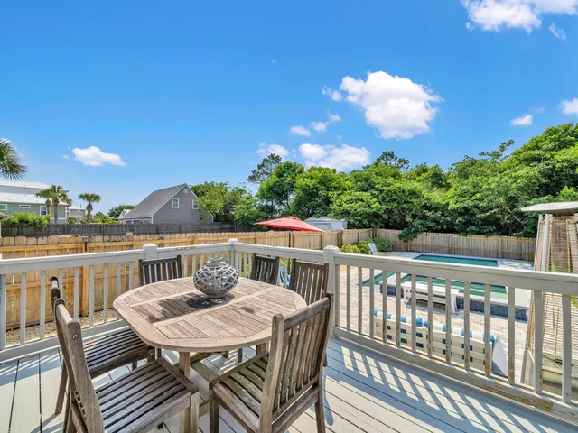 a view of a table and chairs on the roof deck