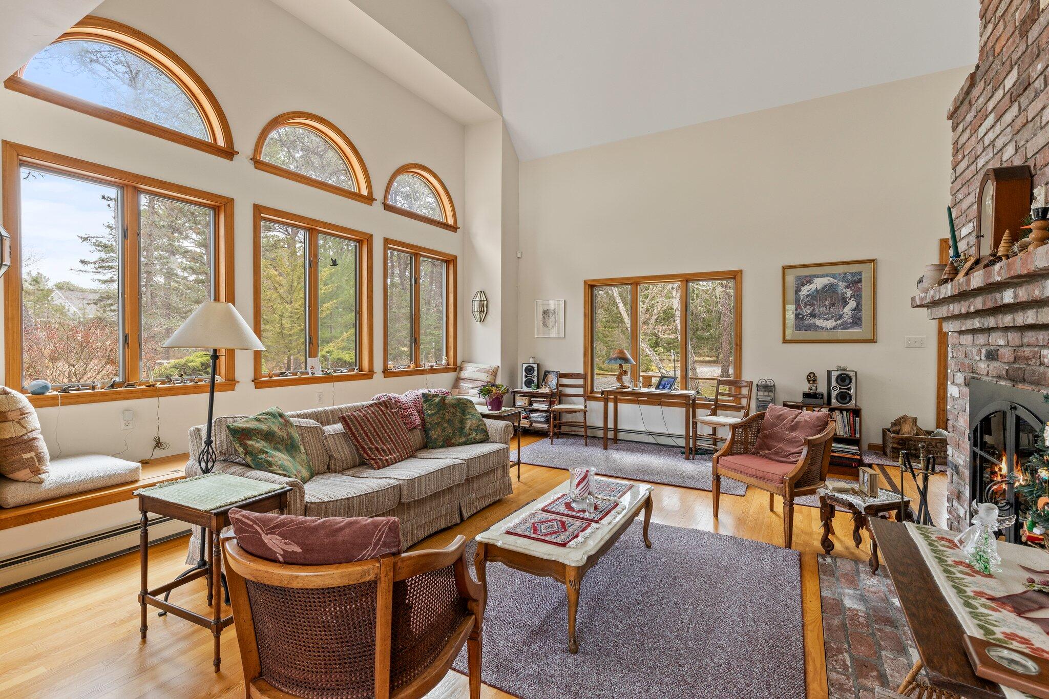 35 Pine Field Road Wellfleet, MA 02667 - Photo 12 of 31 a living room with fireplace furniture and a large window