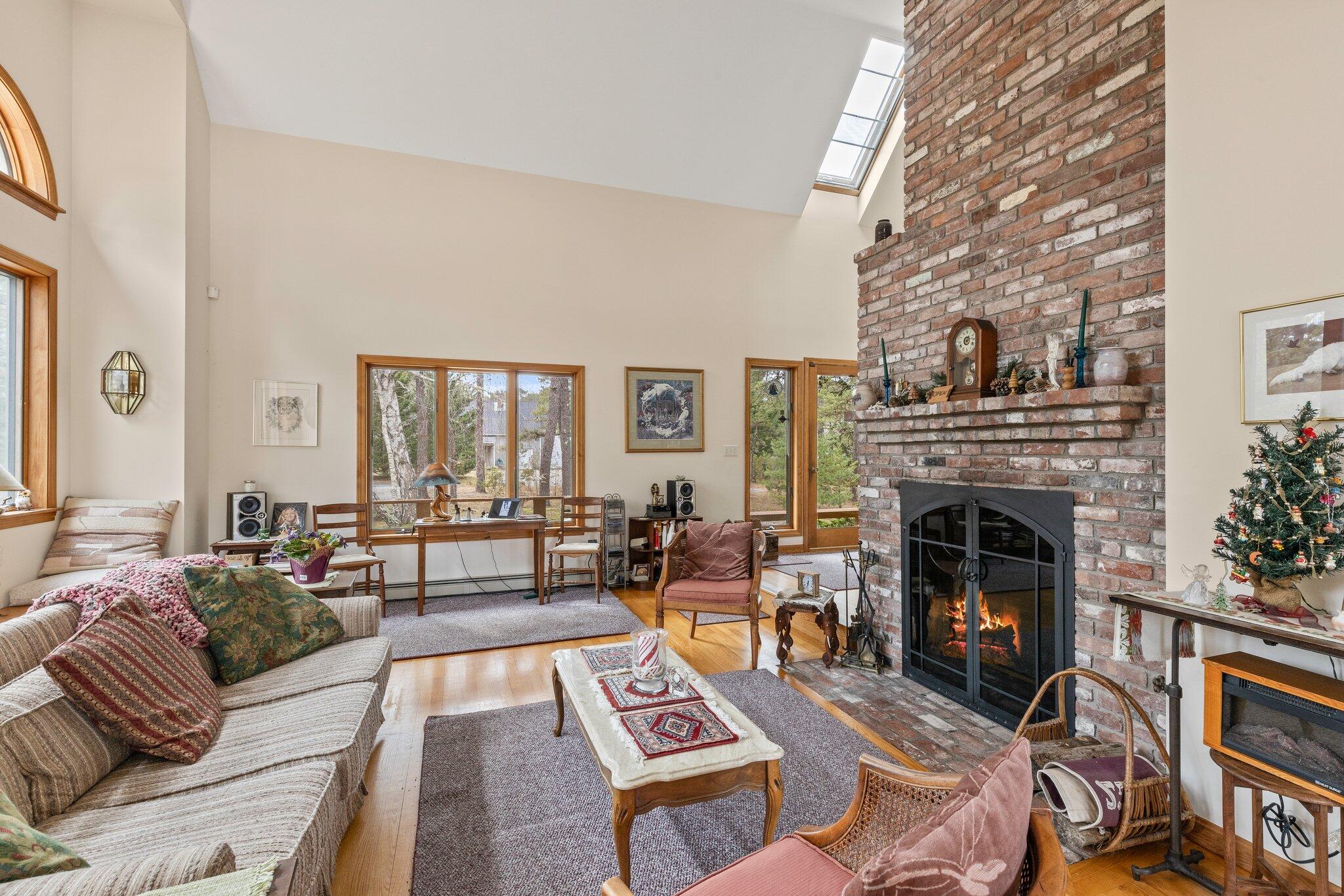 35 Pine Field Road Wellfleet, MA 02667 - Photo 13 of 31 a living room with furniture and a fireplace