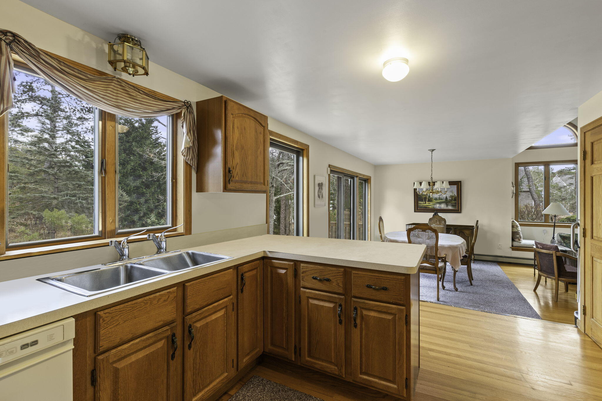35 Pine Field Road Wellfleet, MA 02667 - Photo 15 of 31 a kitchen with a sink and large windows