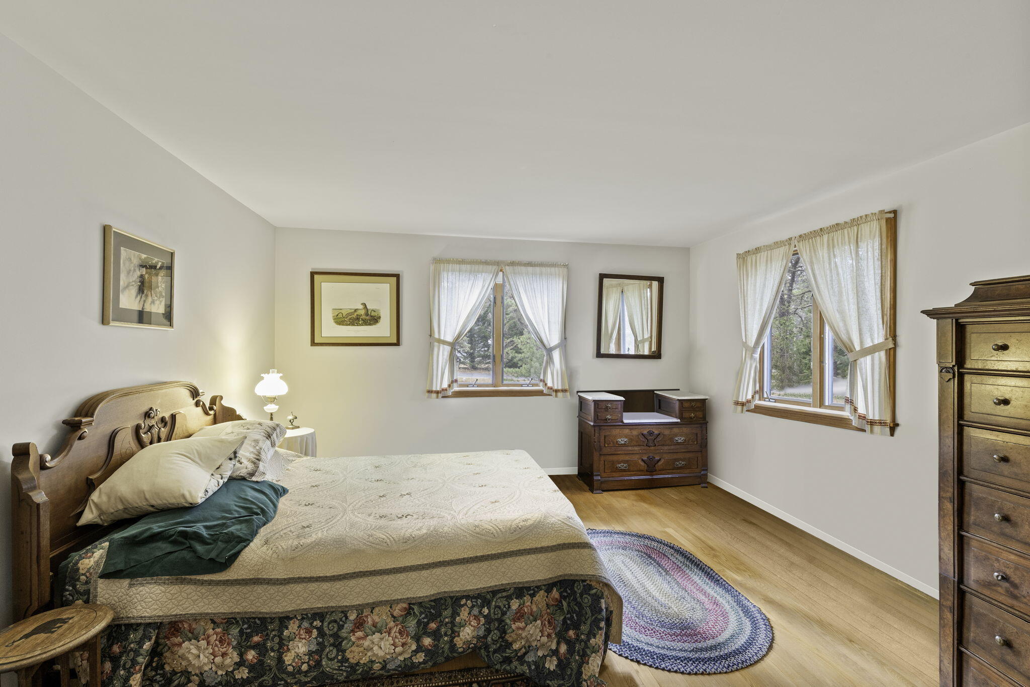 35 Pine Field Road Wellfleet, MA 02667 - Photo 17 of 31 a bedroom with a bed and wooden floor