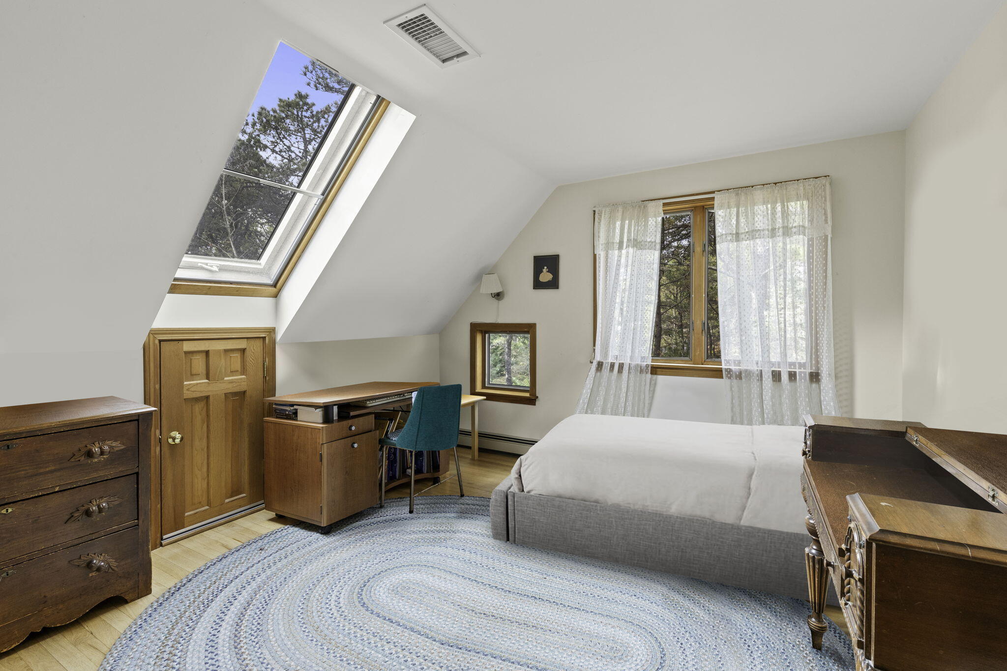 35 Pine Field Road Wellfleet, MA 02667 - Photo 22 of 31 a bedroom with a bed and a dresser