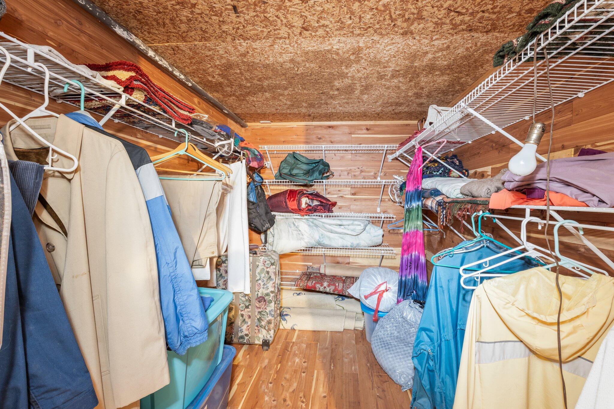 35 Pine Field Road Wellfleet, MA 02667 - Photo 24 of 31 a view of walk in closet with clothes and shoes