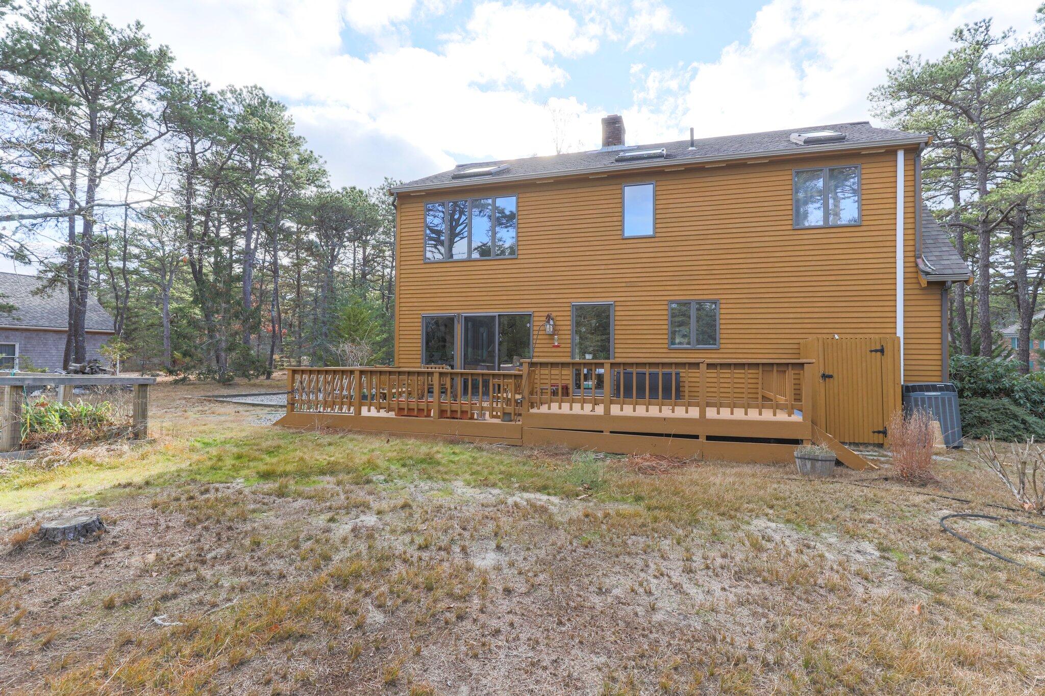 35 Pine Field Road Wellfleet, MA 02667 - Photo 25 of 31 a view of a house with backyard and sitting area