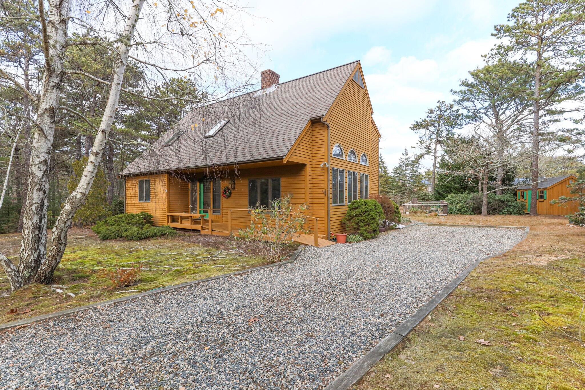 35 Pine Field Road Wellfleet, MA 02667 - Photo 4 of 31 a view of a house with a yard and large tree