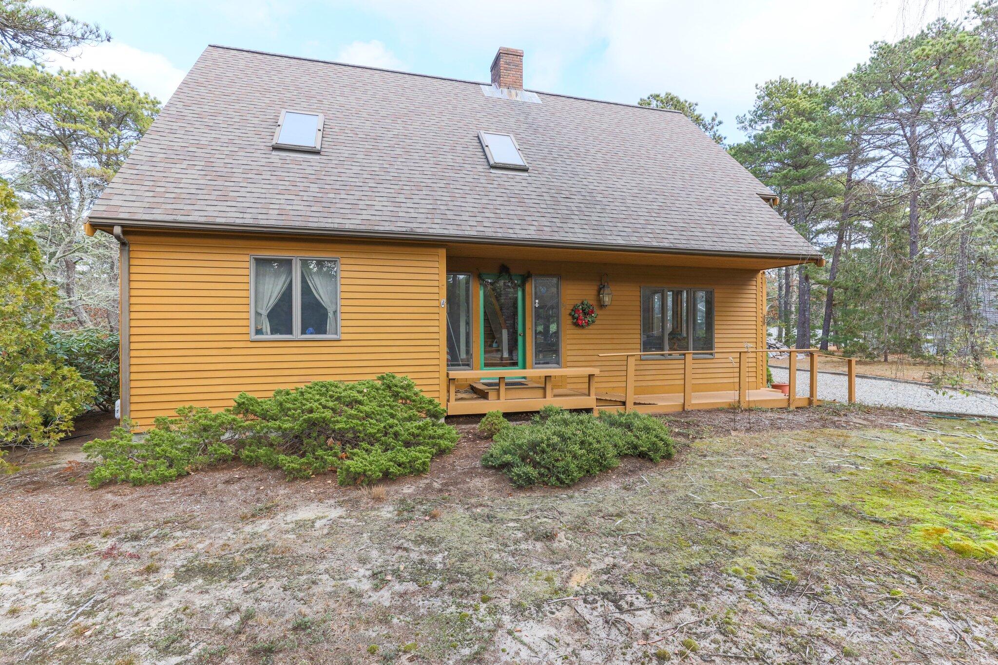 35 Pine Field Road Wellfleet, MA 02667 - Photo 5 of 31 a front view of a house with garden
