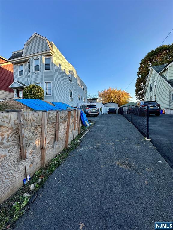 602 Chancellor Avenue Irvington, NJ 07111 - Photo 12 of 13 a view of a house with a yard