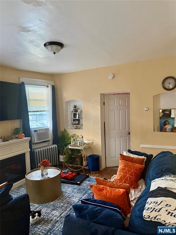 602 Chancellor Avenue Irvington, NJ 07111 - Photo 3 of 13 a living room with furniture and a window