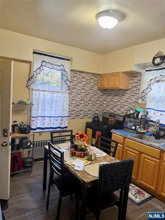 602 Chancellor Avenue Irvington, NJ 07111 - Photo 4 of 13 a dining room with a wooden table and chairs