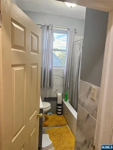 a bath room with a sink and a mirror