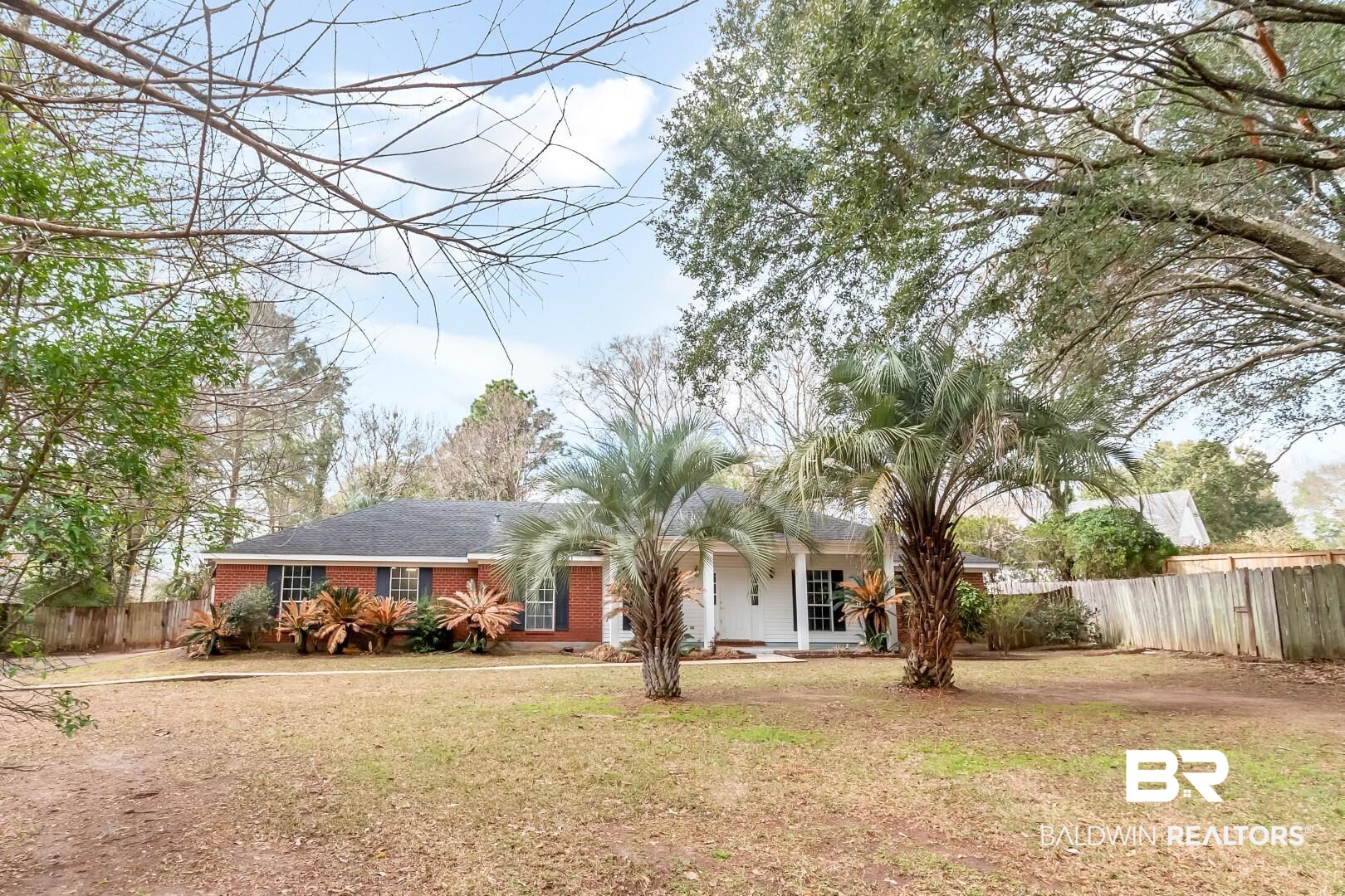 10006 Wedgefield Court Mobile, AL 36608 - Photo 13 of 34 Ranch-style house featuring brick siding, a front lawn, and fence