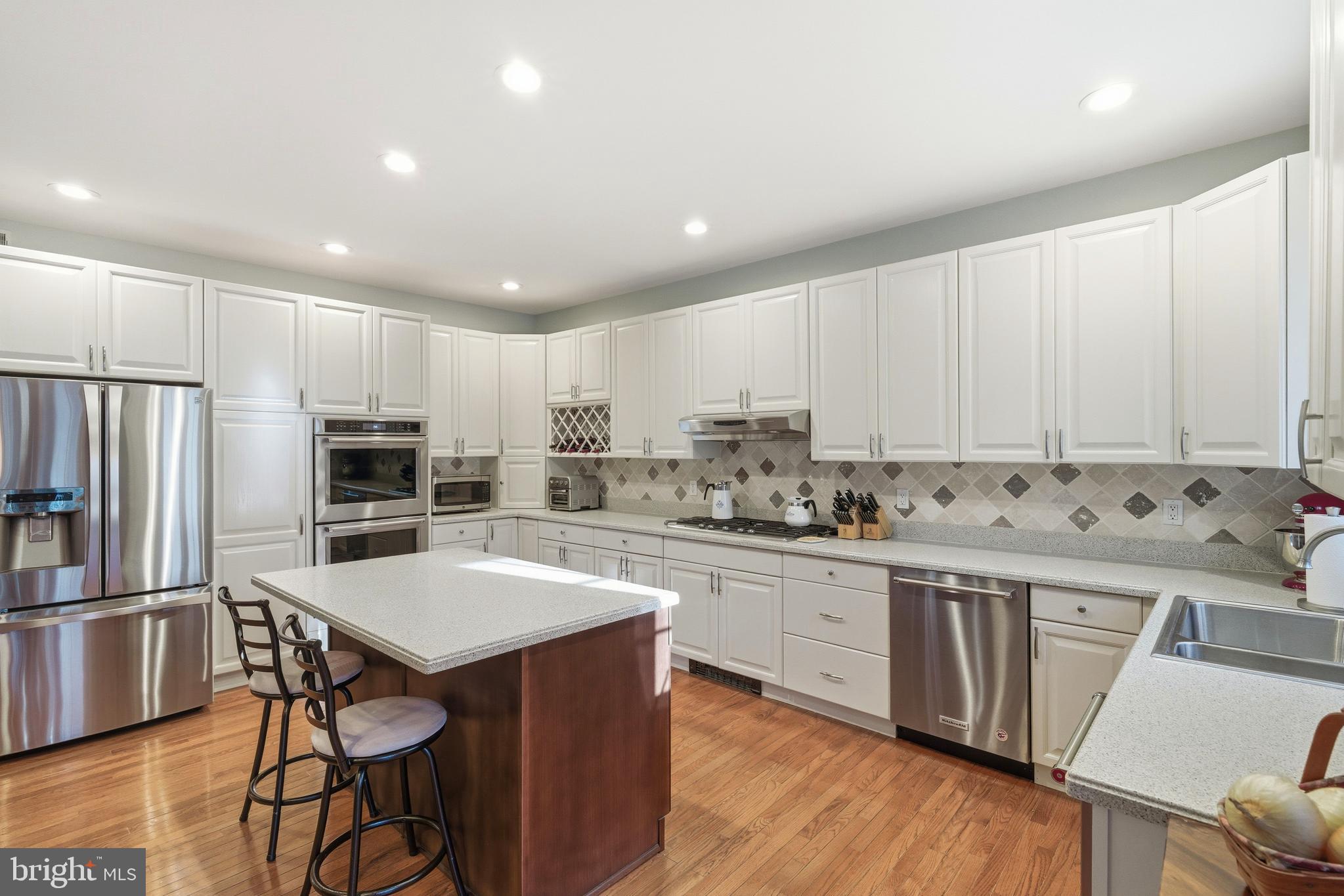 39 Rodeo Drive West Creek, NJ 08092 - Photo 21 of 78 a kitchen with stainless steel appliances a stove a sink a refrigerator and cabinets