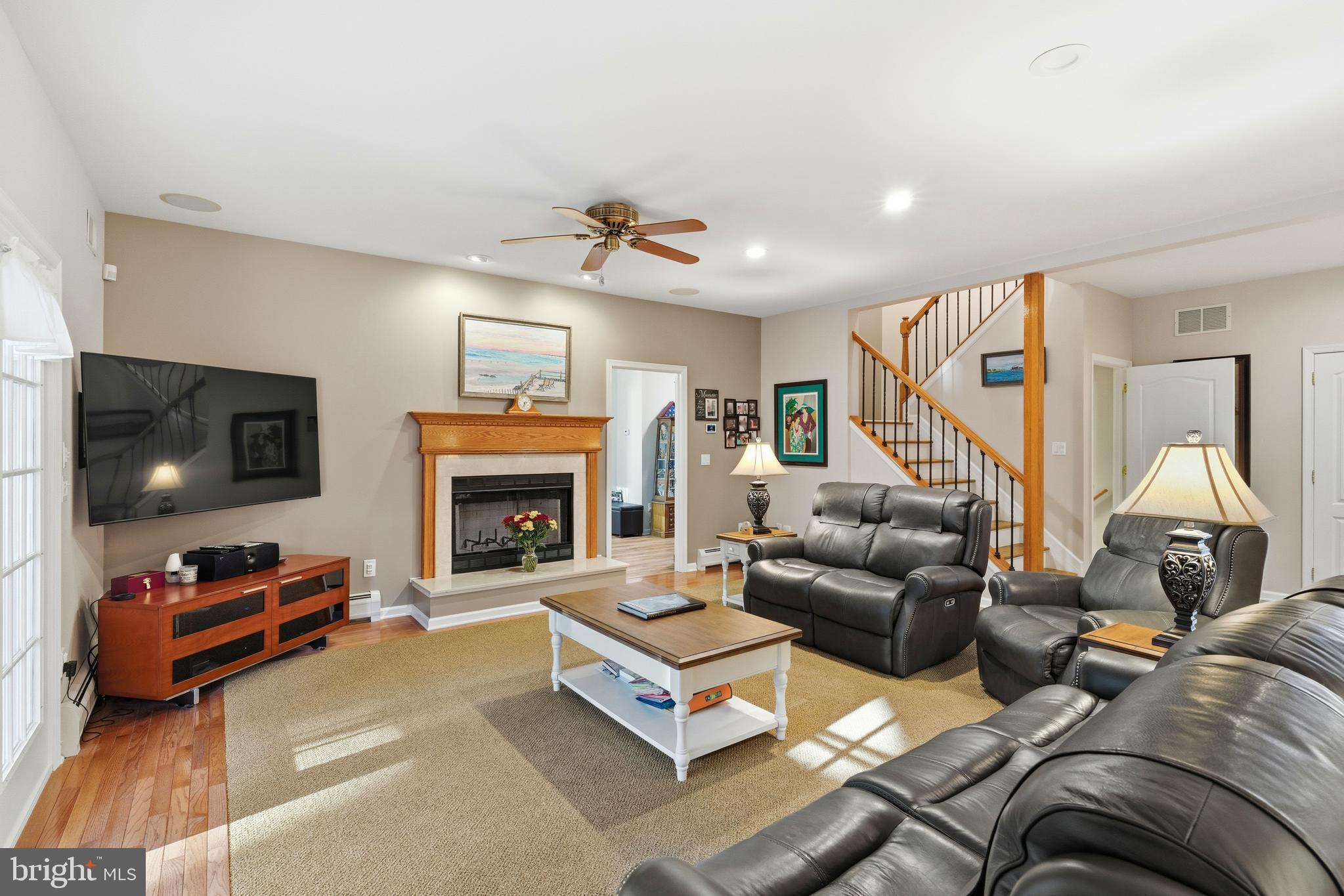 39 Rodeo Drive West Creek, NJ 08092 - Photo 32 of 78 a living room with furniture and a fireplace