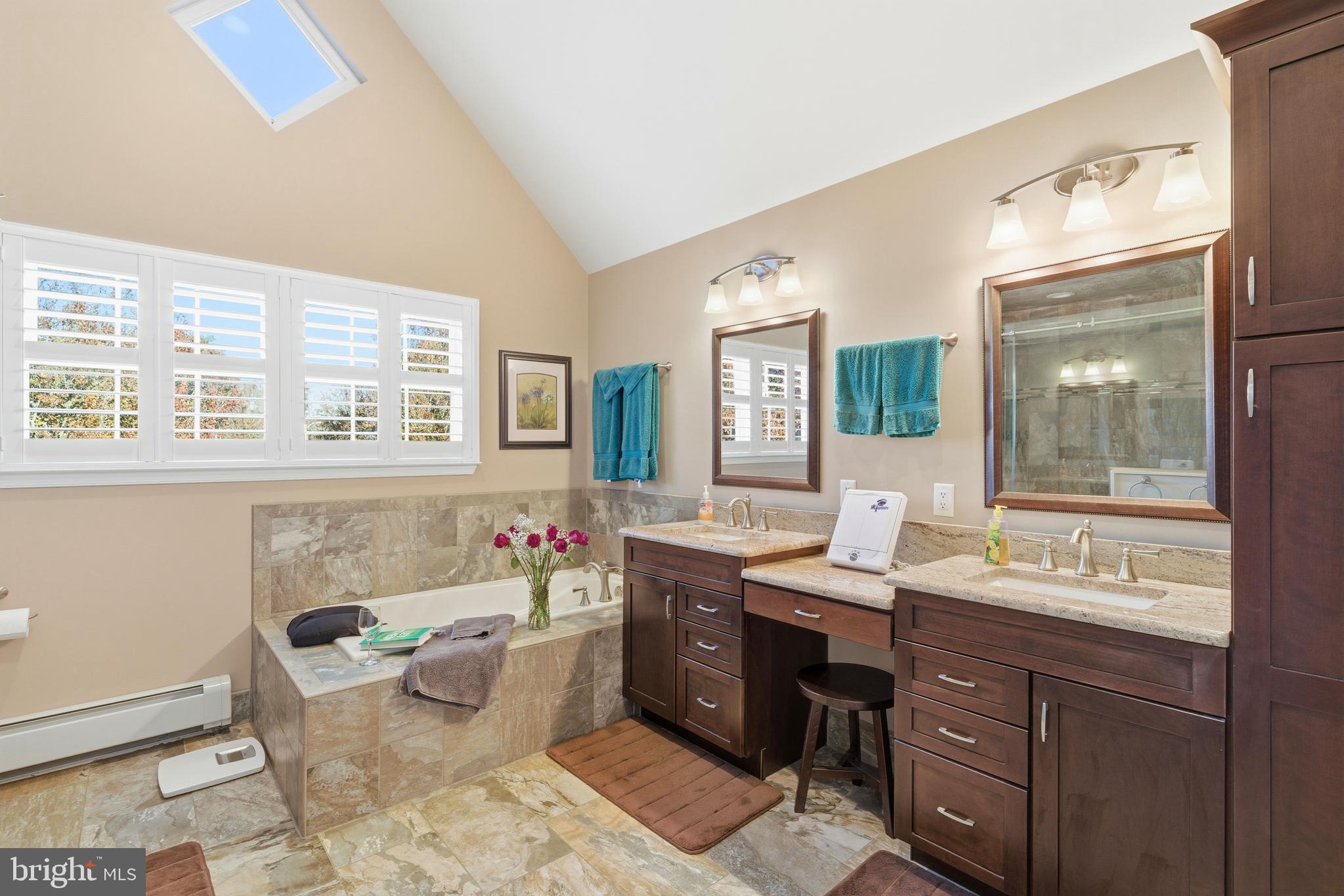 39 Rodeo Drive West Creek, NJ 08092 - Photo 52 of 78 a bathroom with a tub sink and mirror