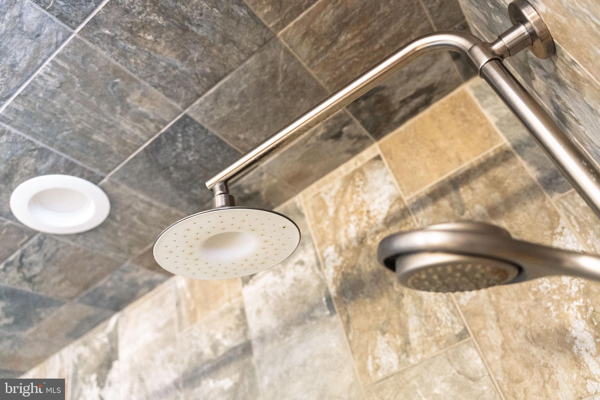 39 Rodeo Drive West Creek, NJ 08092 - Photo 56 of 78 a bathroom with a granite countertop sink and a mirror