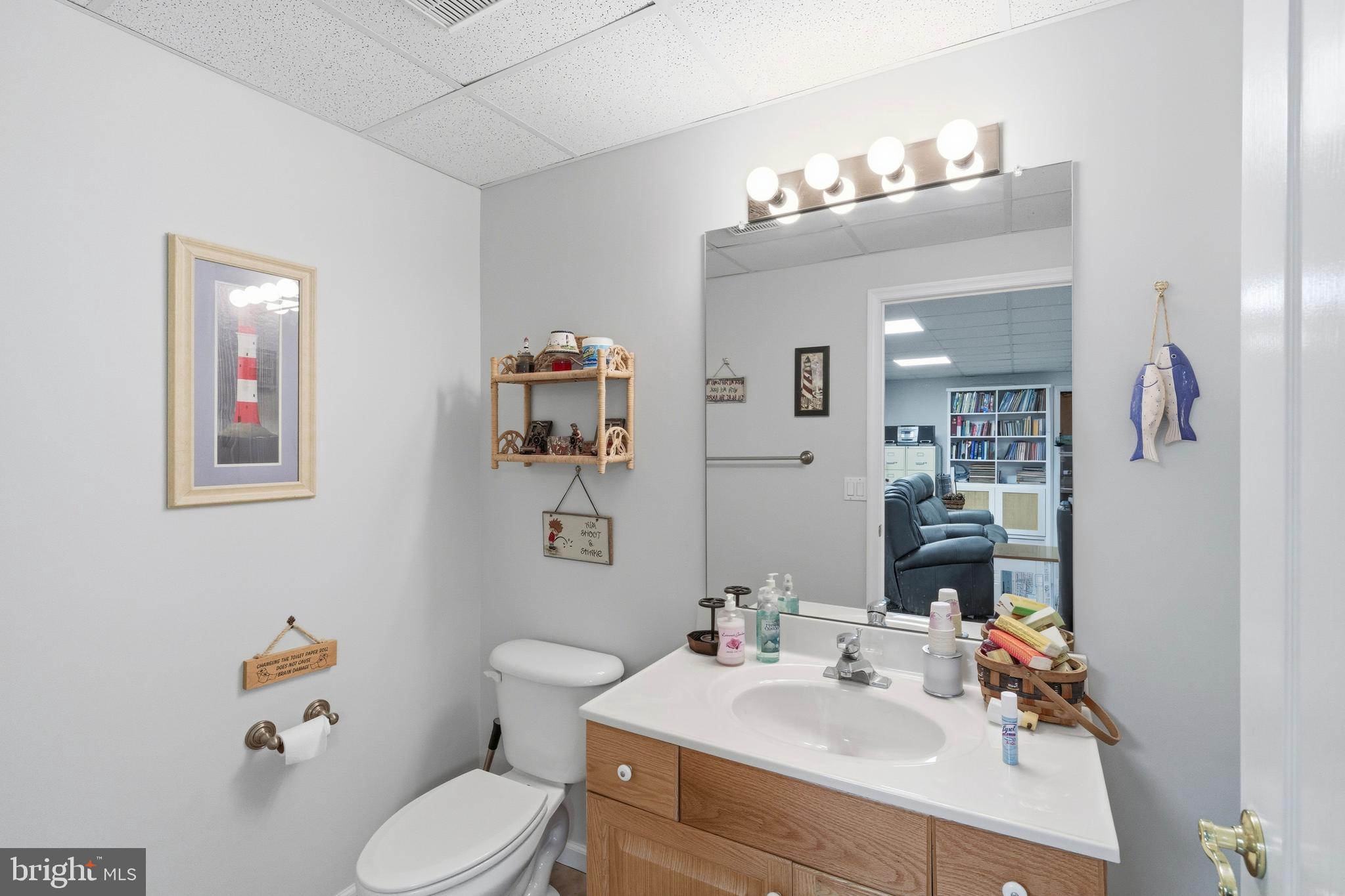 39 Rodeo Drive West Creek, NJ 08092 - Photo 66 of 78 a bathroom with a sink vanity mirror and toilet