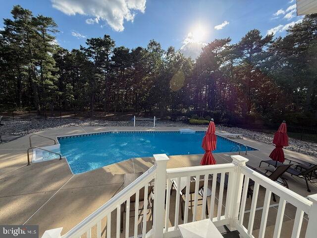 39 Rodeo Drive West Creek, NJ 08092 - Photo 71 of 78 a view of a swimming pool with a deck and a patio