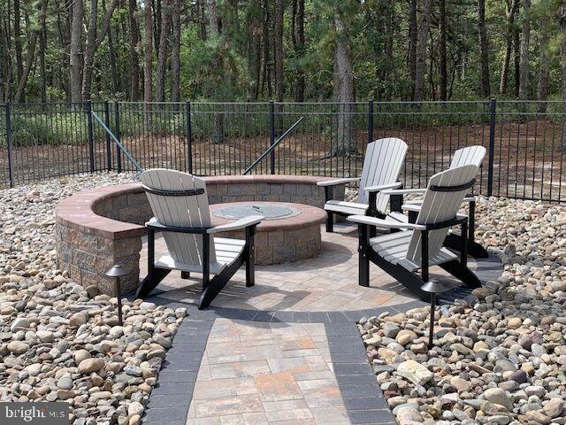 39 Rodeo Drive West Creek, NJ 08092 - Photo 72 of 78 a view of a chairs and tables in the back yard of the house