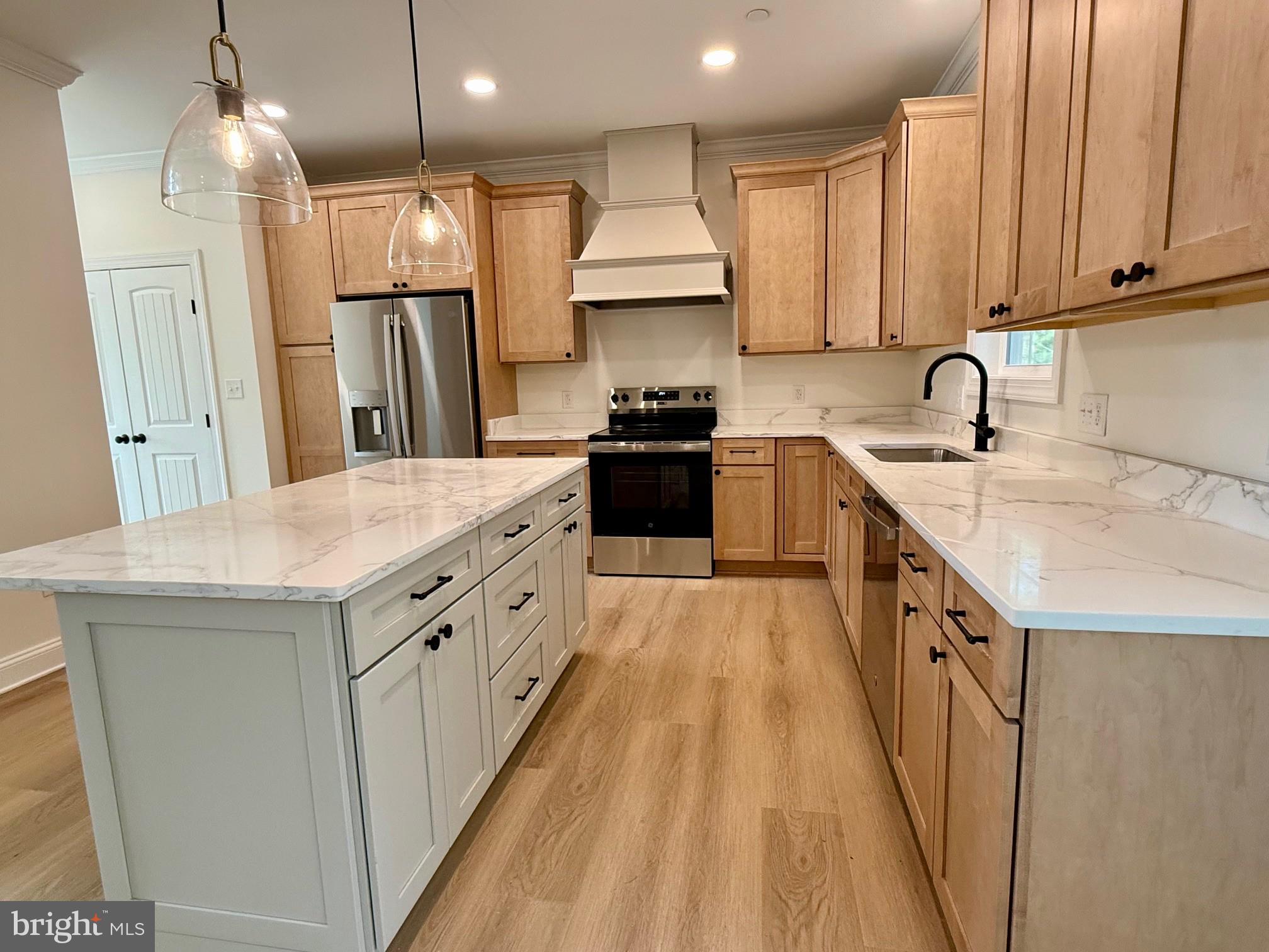 17490 Lighthouse Commons Drive Piney Point, MD 20674 - Photo 20 of 44 a kitchen with a sink stove and refrigerator