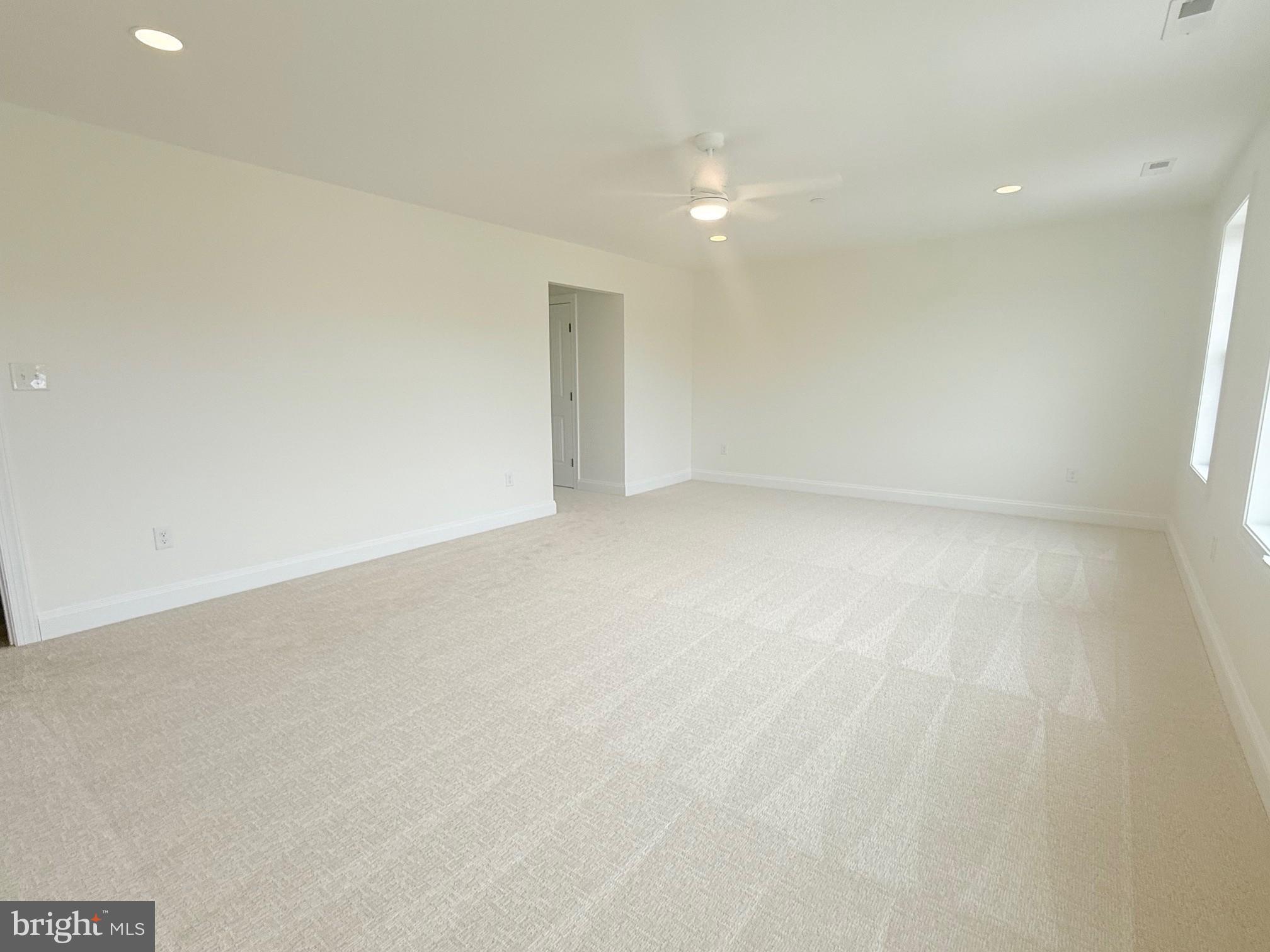 17490 Lighthouse Commons Drive Piney Point, MD 20674 - Photo 27 of 44 an empty room with a natural light