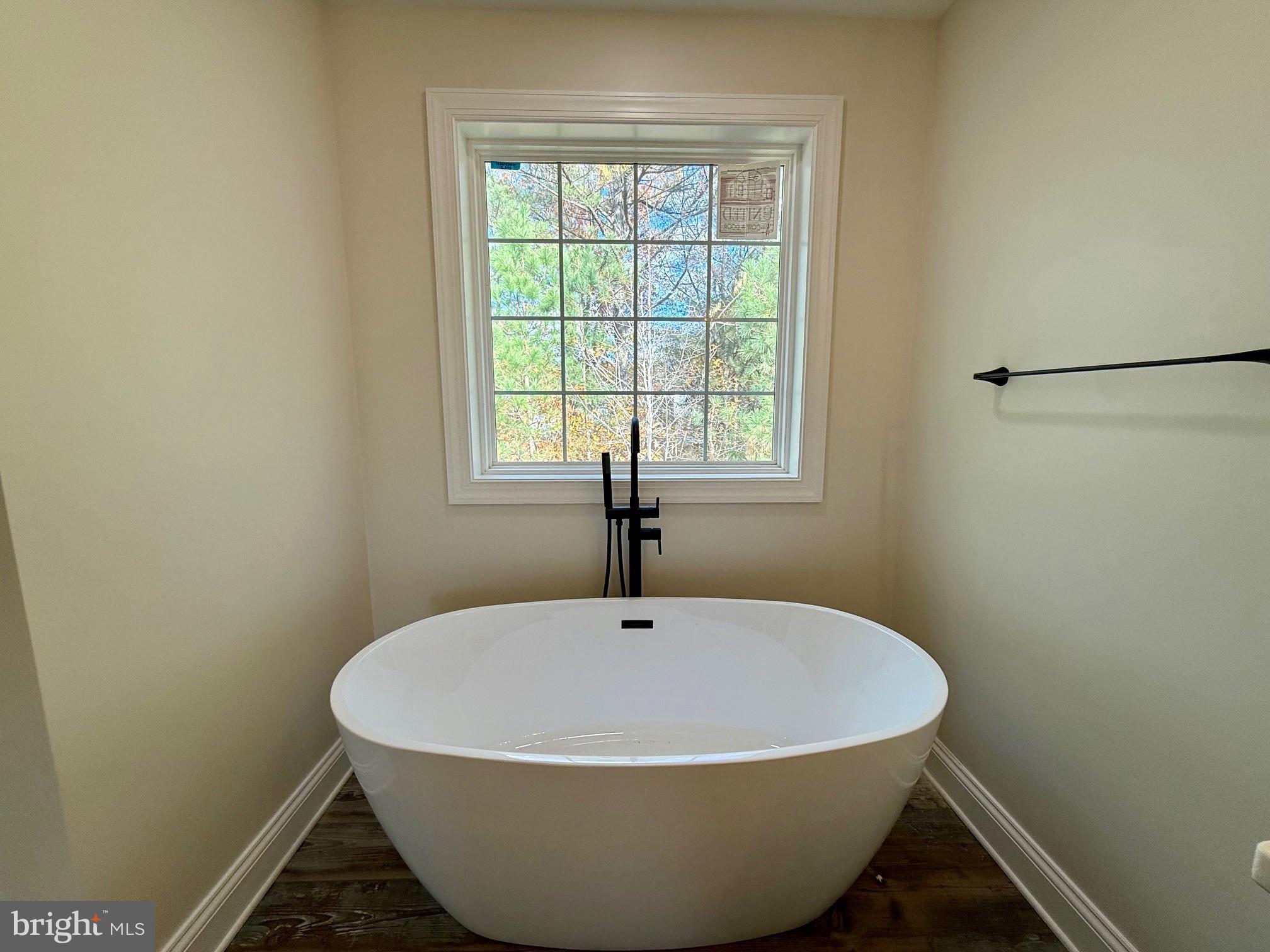 17490 Lighthouse Commons Drive Piney Point, MD 20674 - Photo 30 of 44 a white bath tub sitting in a bathroom next to a window