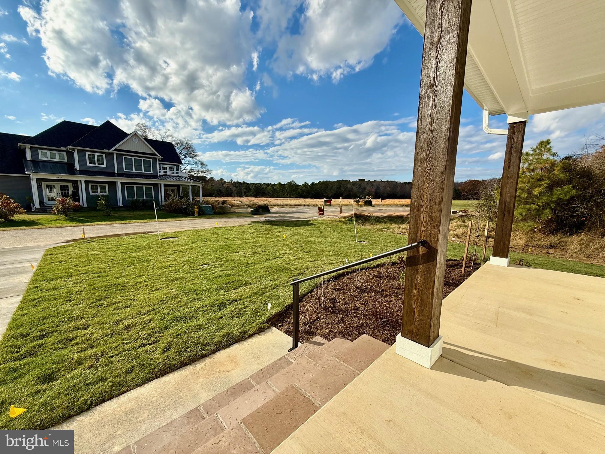 17490 Lighthouse Commons Drive Piney Point, MD 20674 - Photo 3 of 44 a view of a swimming pool with an ocean view
