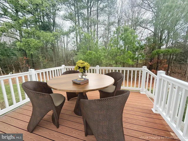 a view of a table and chairs on the roof deck