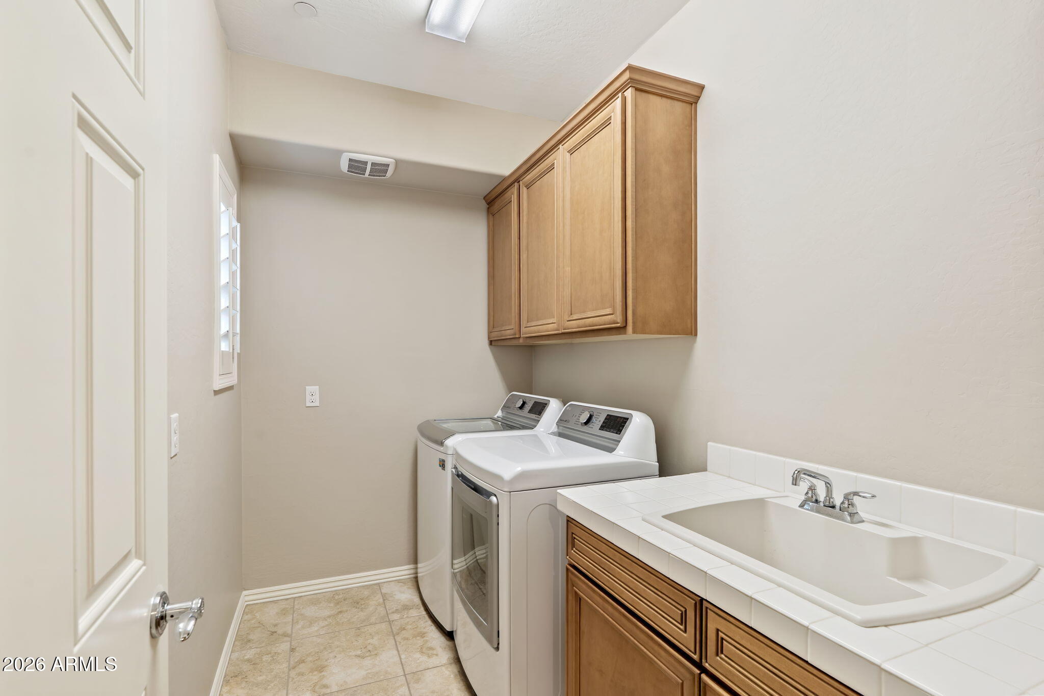 3935 East Rough Rider Road, Unit 1332 Phoenix, AZ 85050 - Photo 35 of 35 Large Laundry Room