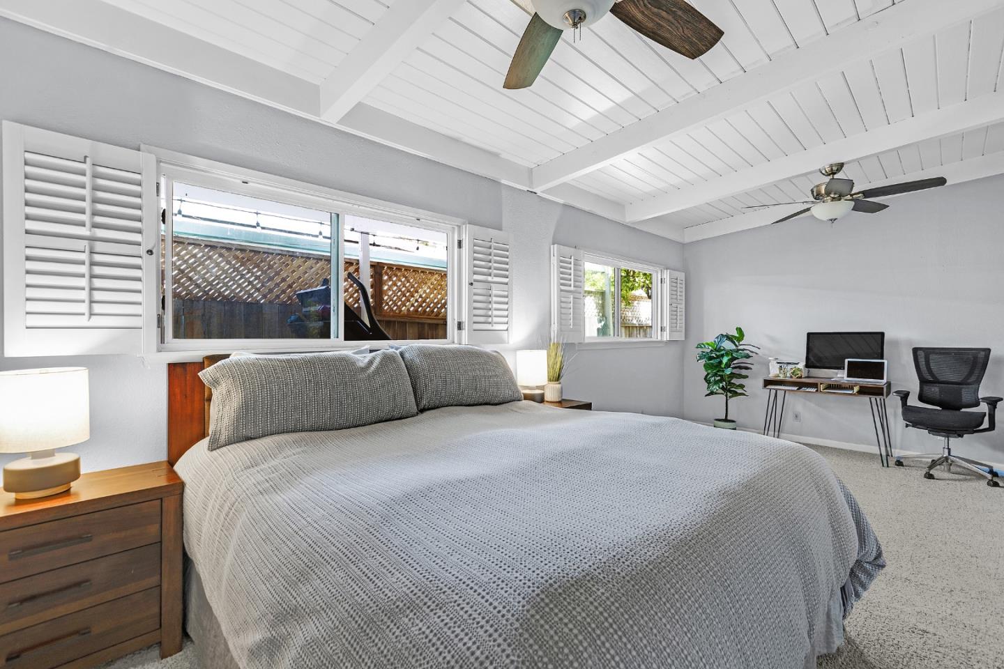 811 Wake Forest Drive Mountain View, CA 94043 - Photo 12 of 28 a bedroom with a balcony a bed and a chair