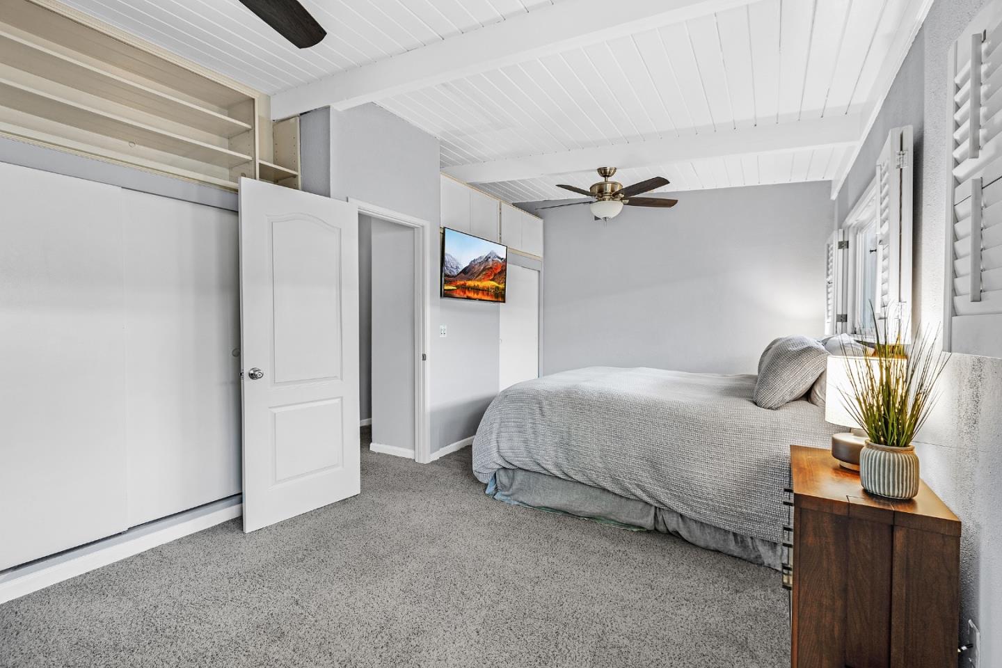 811 Wake Forest Drive Mountain View, CA 94043 - Photo 16 of 28 a bedroom with a bed and a chandelier