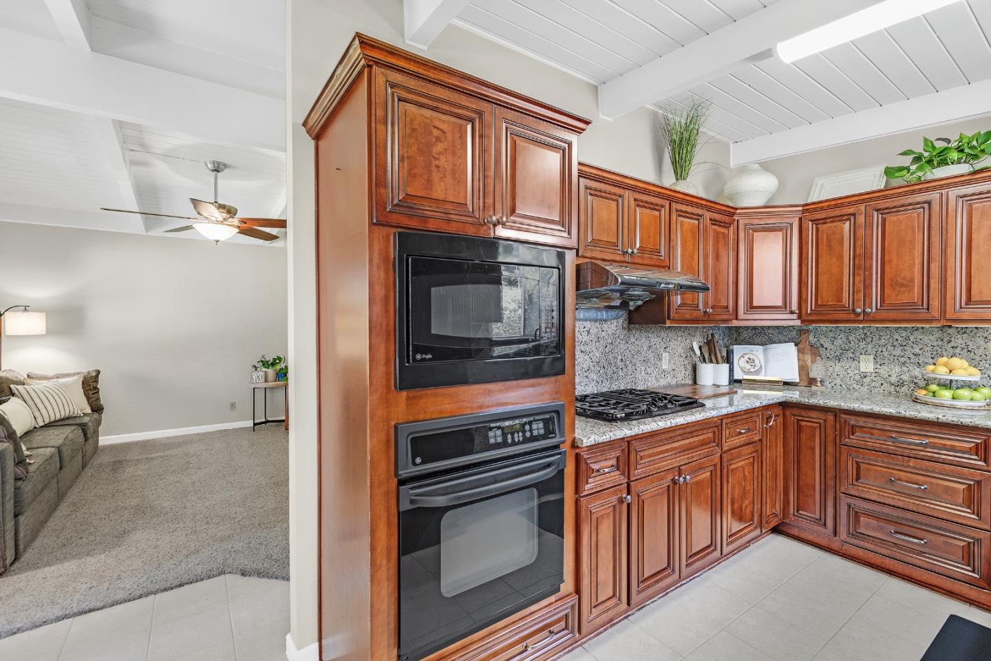 811 Wake Forest Drive Mountain View, CA 94043 - Photo 7 of 28 a kitchen with stainless steel appliances granite countertop a sink and cabinets