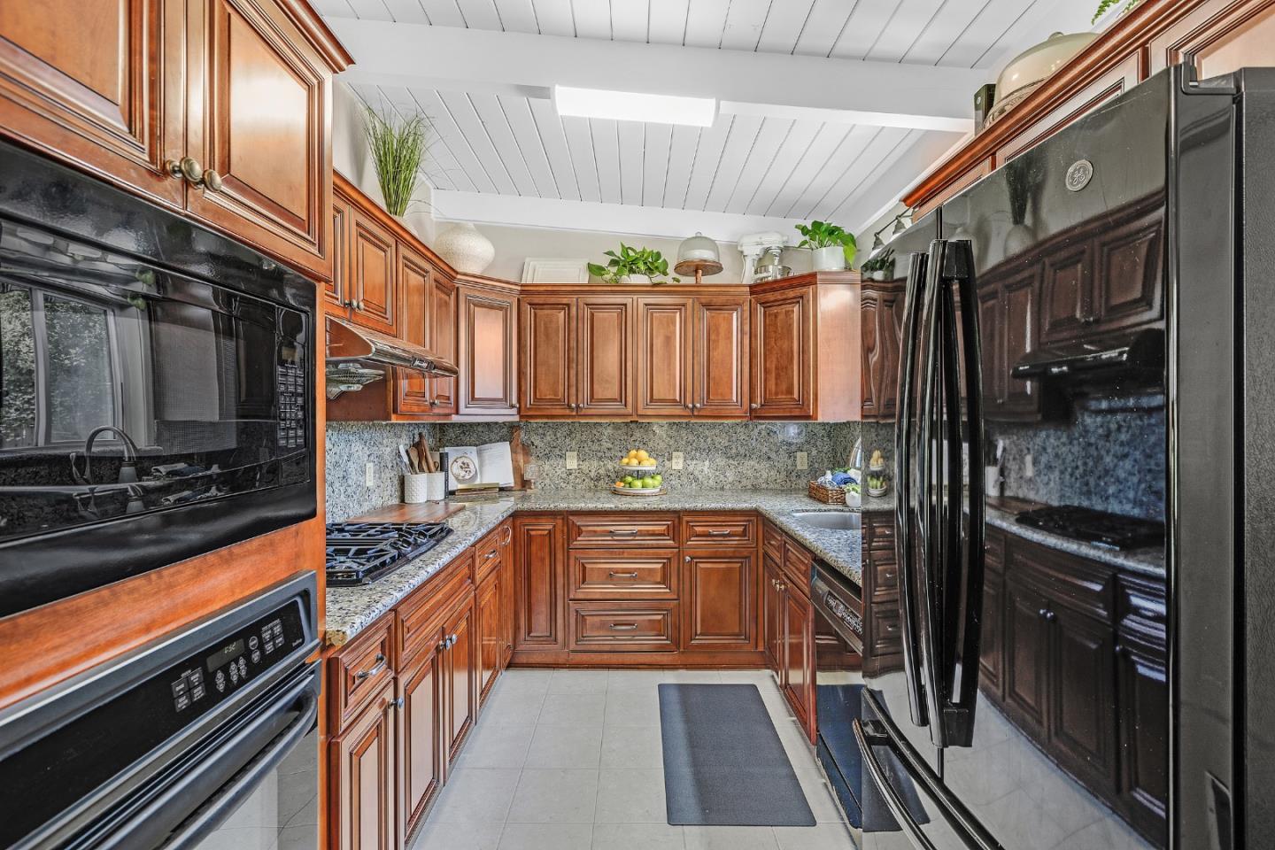 811 Wake Forest Drive Mountain View, CA 94043 - Photo 8 of 28 a kitchen with stainless steel appliances a stove a sink and cabinets