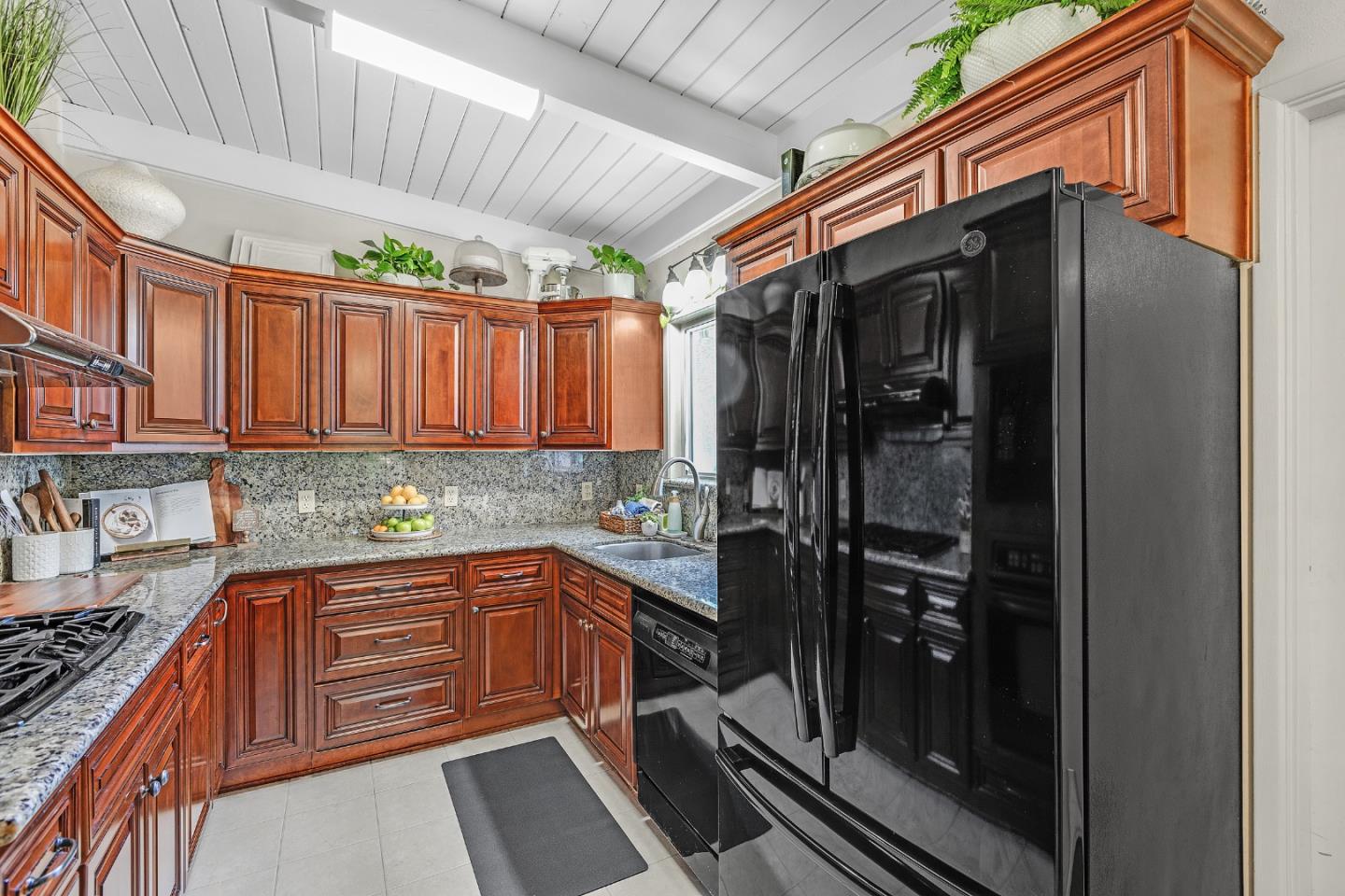 811 Wake Forest Drive Mountain View, CA 94043 - Photo 9 of 28 a kitchen with a sink and cabinets