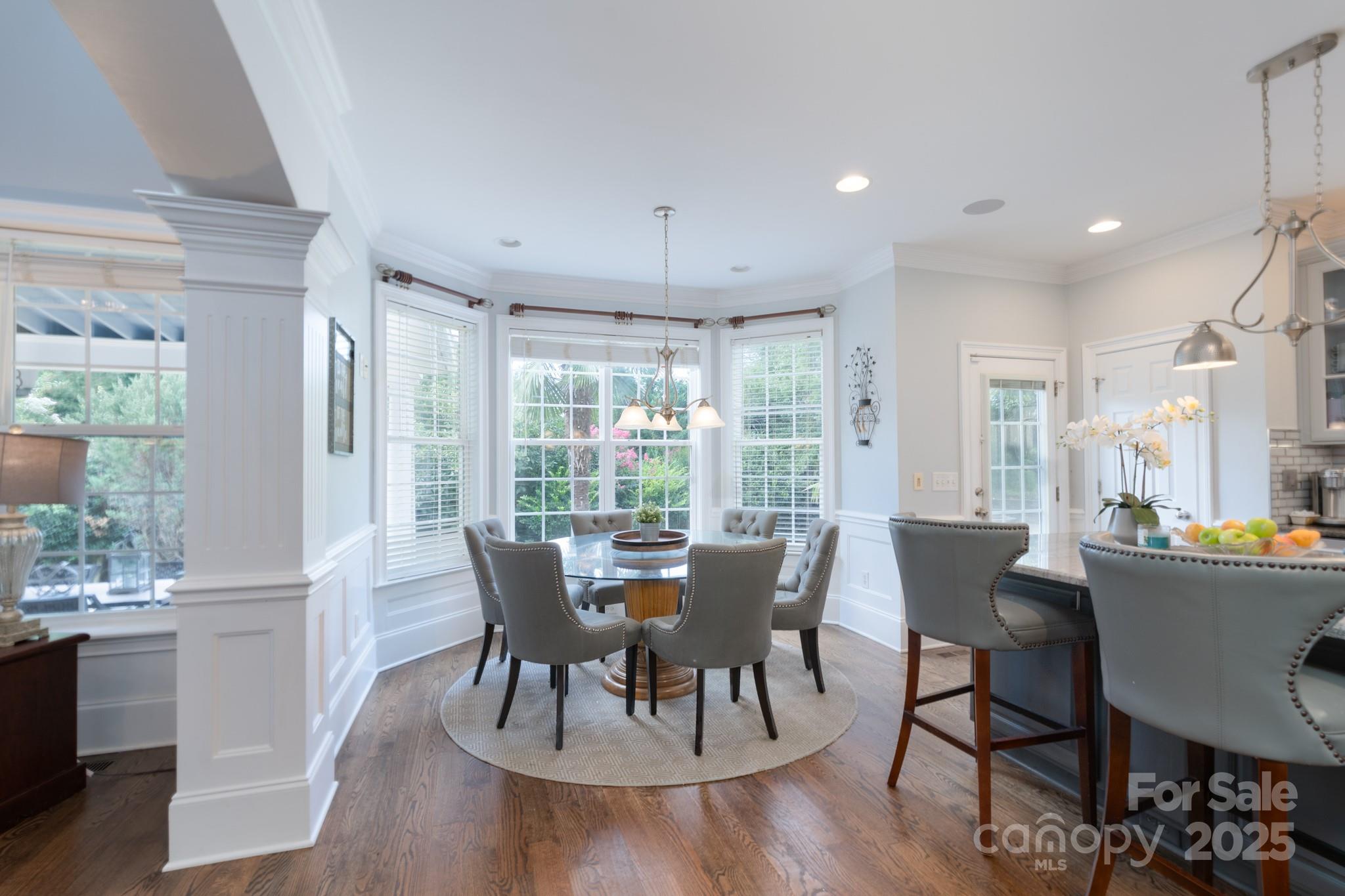 779 Fairway Point Drive Tega Cay, SC 29708 - Photo 14 of 48 a view of a dining room with furniture window and wooden floor