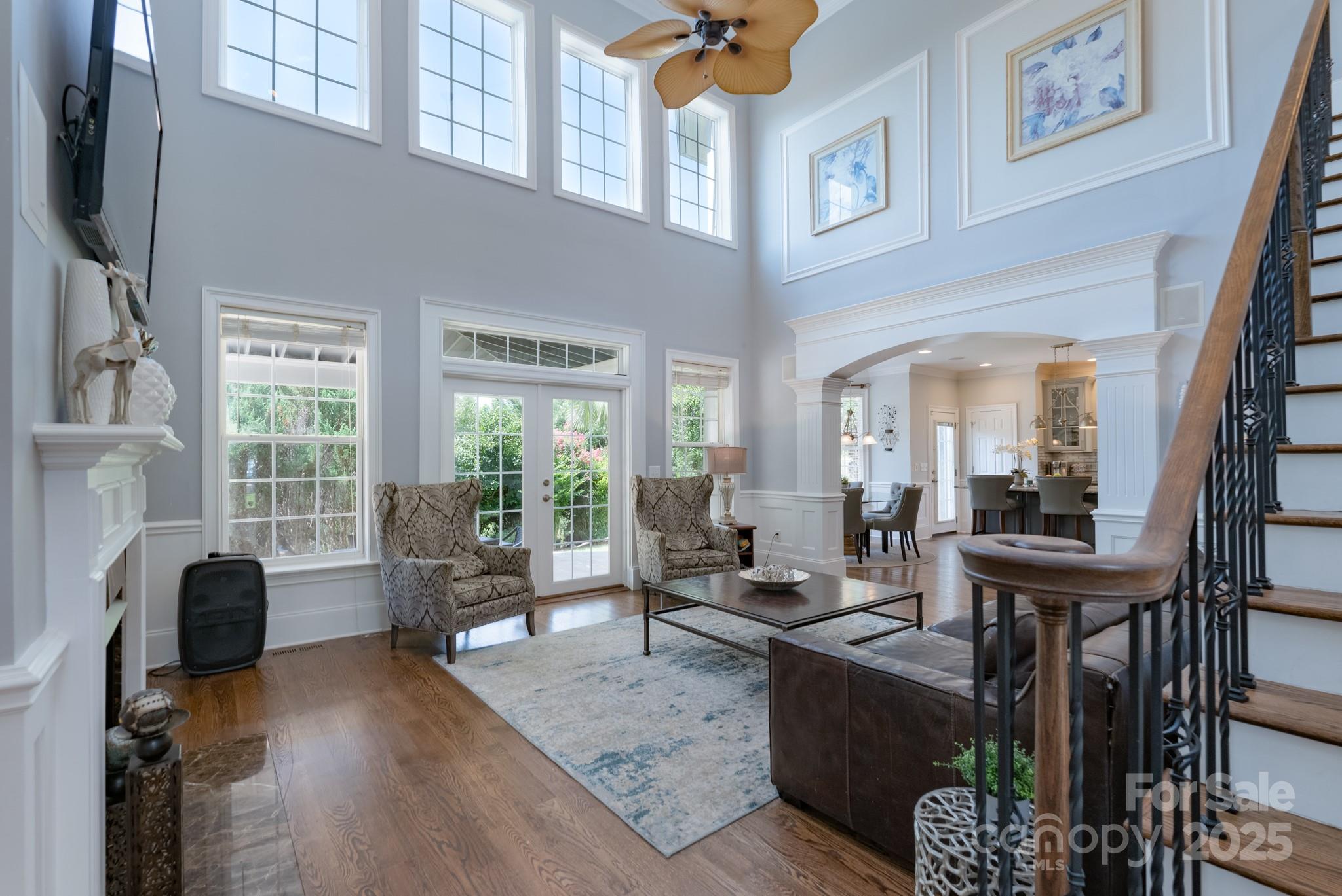 779 Fairway Point Drive Tega Cay, SC 29708 - Photo 15 of 48 a living room with furniture large window and wooden floor