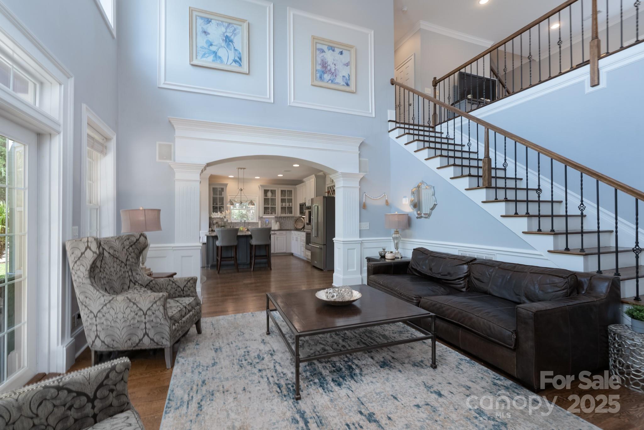 779 Fairway Point Drive Tega Cay, SC 29708 - Photo 17 of 48 a living room with furniture and a chandelier
