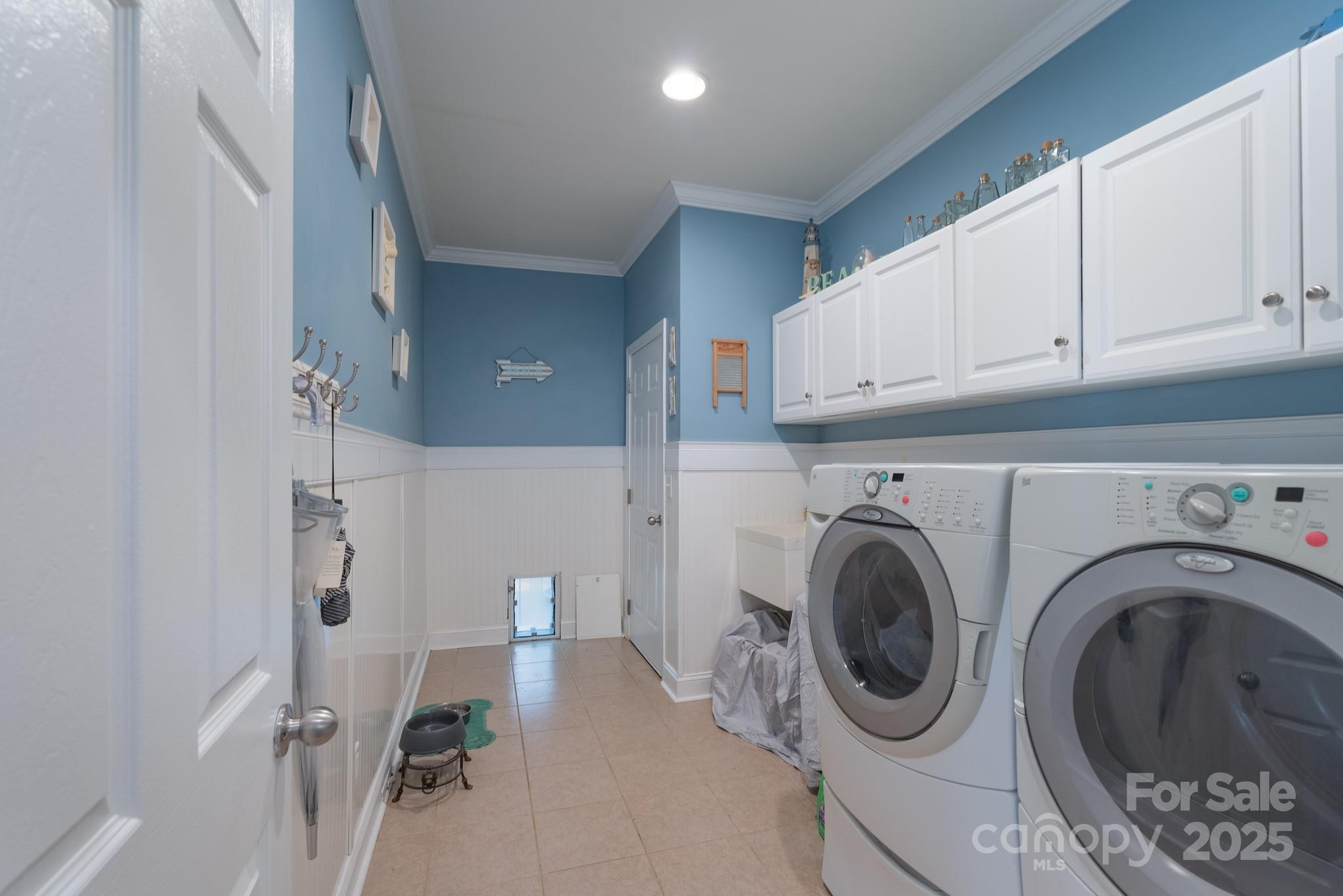779 Fairway Point Drive Tega Cay, SC 29708 - Photo 19 of 48 a view of a kitchen with a washer and dryer