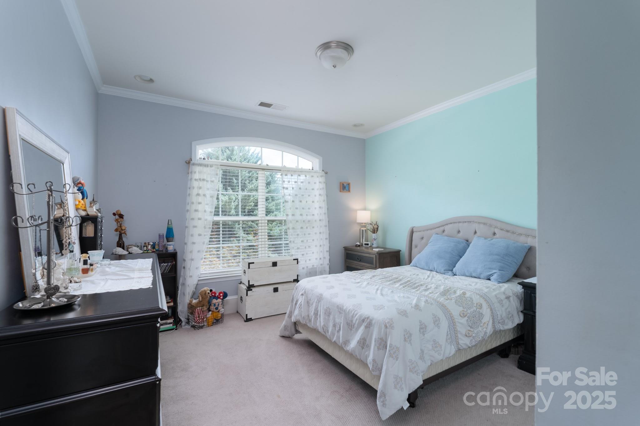 779 Fairway Point Drive Tega Cay, SC 29708 - Photo 26 of 48 a bedroom with a bed and large windows