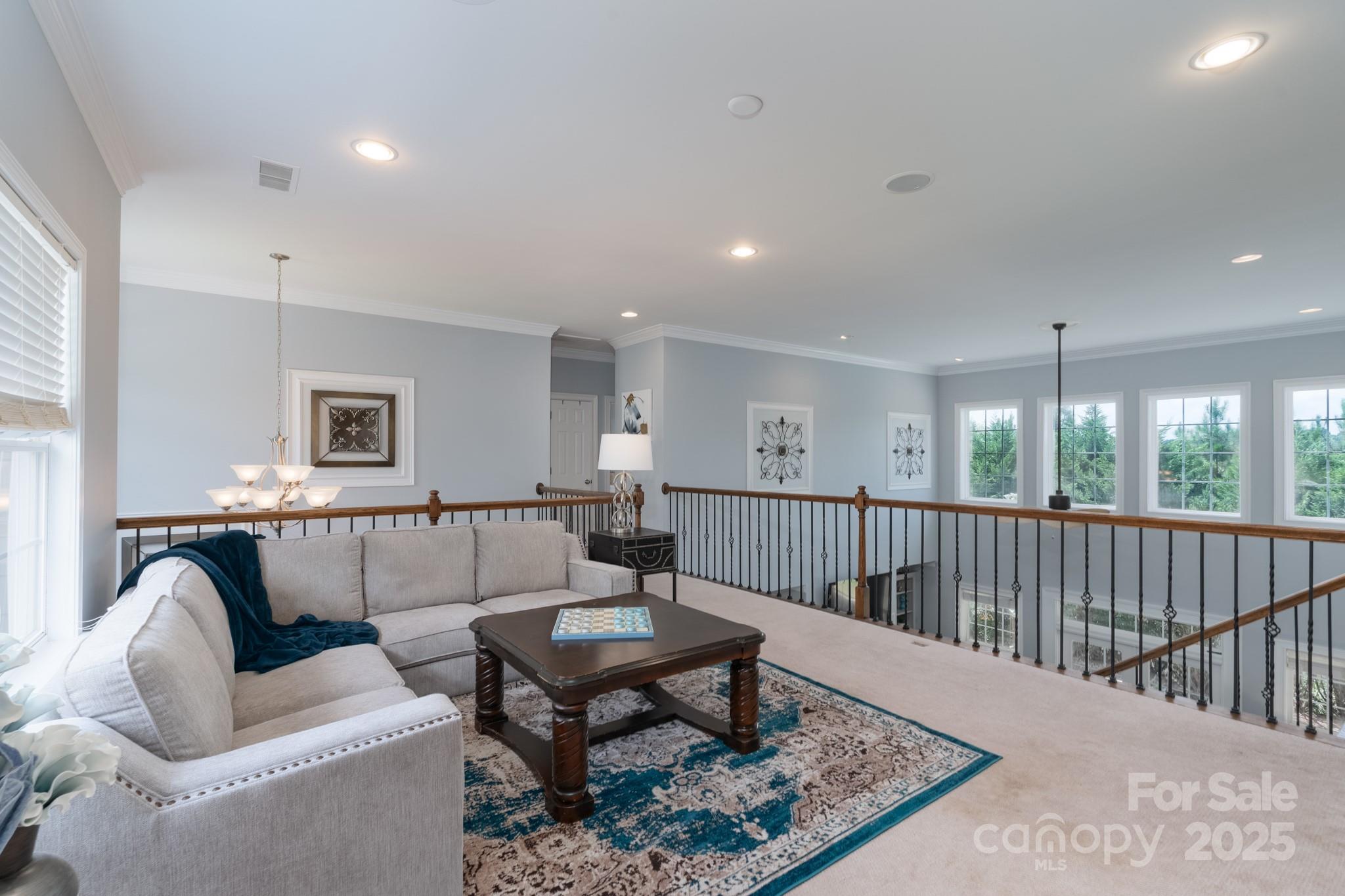779 Fairway Point Drive Tega Cay, SC 29708 - Photo 27 of 48 a living room with furniture a rug and a table