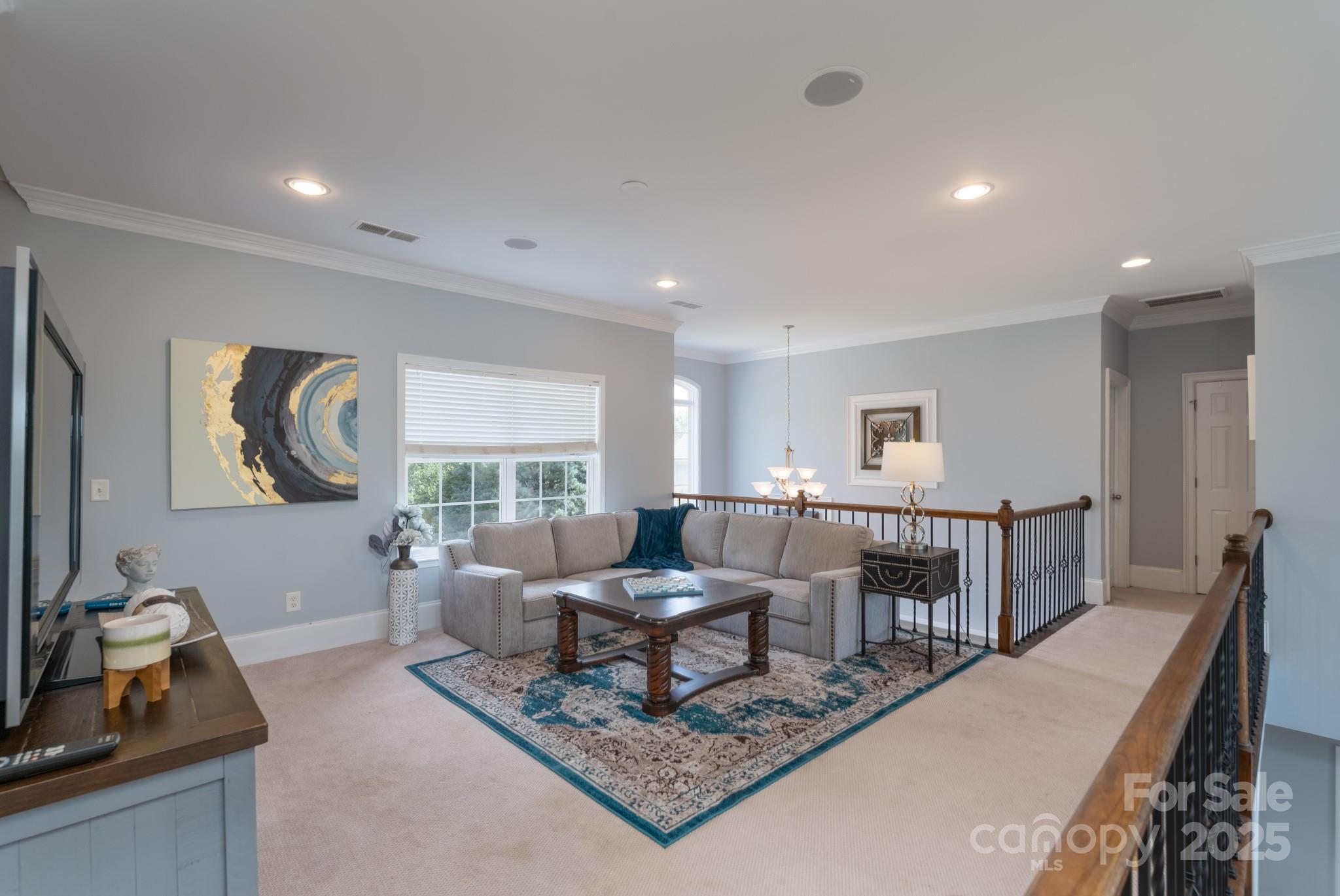 779 Fairway Point Drive Tega Cay, SC 29708 - Photo 30 of 48 a living room with furniture and a window